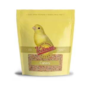 A yellow bird sitting on top of some food.