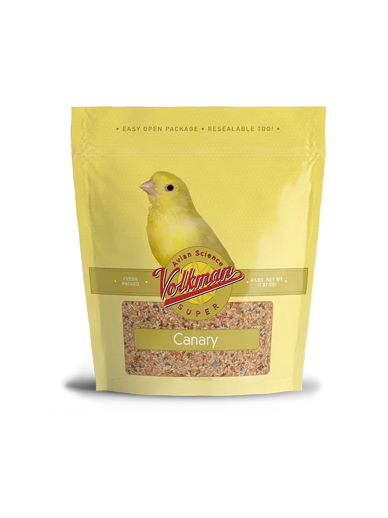 A yellow bird sitting on top of some food.